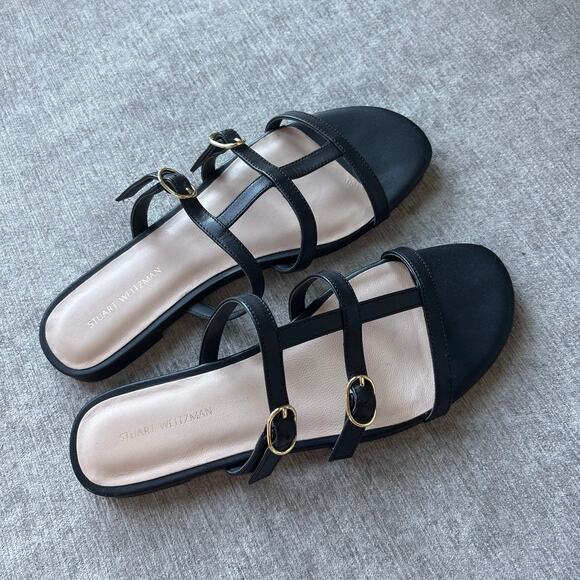 $300 Stuart Weitzman Grecian Buckle flat slide sandals in black leather - Picture 1 of 4
